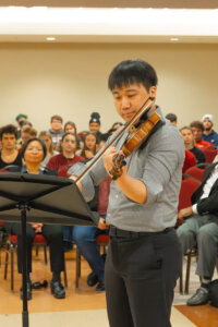 Shenandoah University DMA graduate student Jian Song plays the violin during a musical performance at International Convocation
