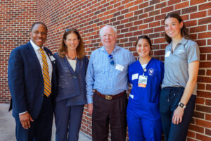 Shenandoah officials and students with Cecil Pruitt Jr. (center) at the dedication of the Cecil Pruitt, Jr. Health & Life Sciences Building.