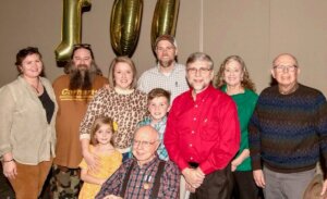 Shenandoah graduate Cy Maulden, with his family, at his 100th birthday party.