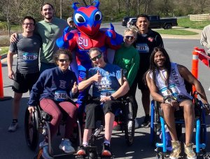 Group gathered for the inaugural Buzzy's Race for Research organized by Shenandoah University physical therapy students in April 2024. Group includes wheelchair users who "rolled" at the event, which benefits The Foundation for Physical Therapy research awards