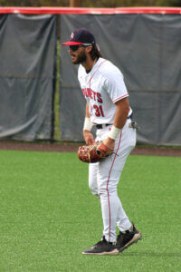Shenandoah University baseball player Gavin Horning stands in center field.