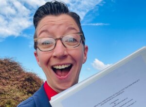 Shenandoah University Ph.D. in educational leadership student Annmarie Noonan '24, holding her award-winning dissertation.