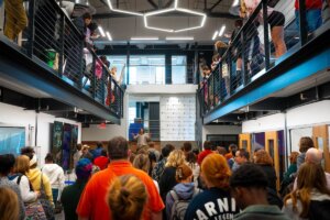 A group of people attend International Convocation in Hazel-Pruitt Armory.