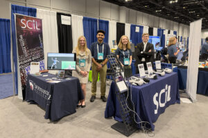 Shenandoah University students at the SCiL booth set up at I/ITSEC.