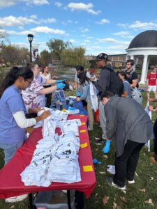 Students prepare to tie dye T-shirts during a voter engagement event in Sarah's Glen.