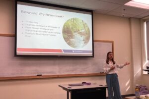 Biology and Public Health double major Mackenzie "Mac" Watkins '26 gives a presentation.