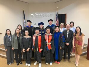(June 23, 2025) – Three SU Global MBA graduates were honored during a hooding ceremony held in Stimpson Auditorium, Halpin-Harrison Hall, alongside university administrators, faculty, and staff.