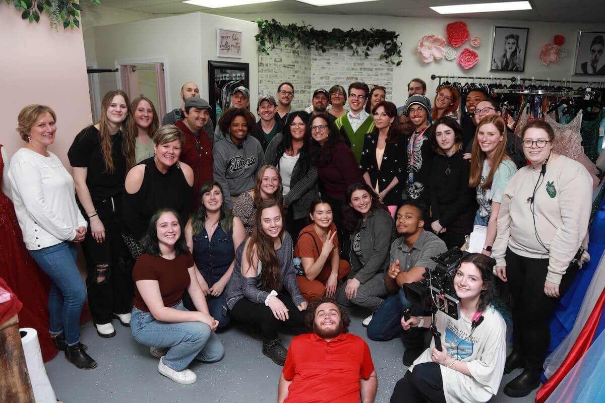 Shenandoah University students pose for a group photo on-set with cast members of "Miss Valentine."