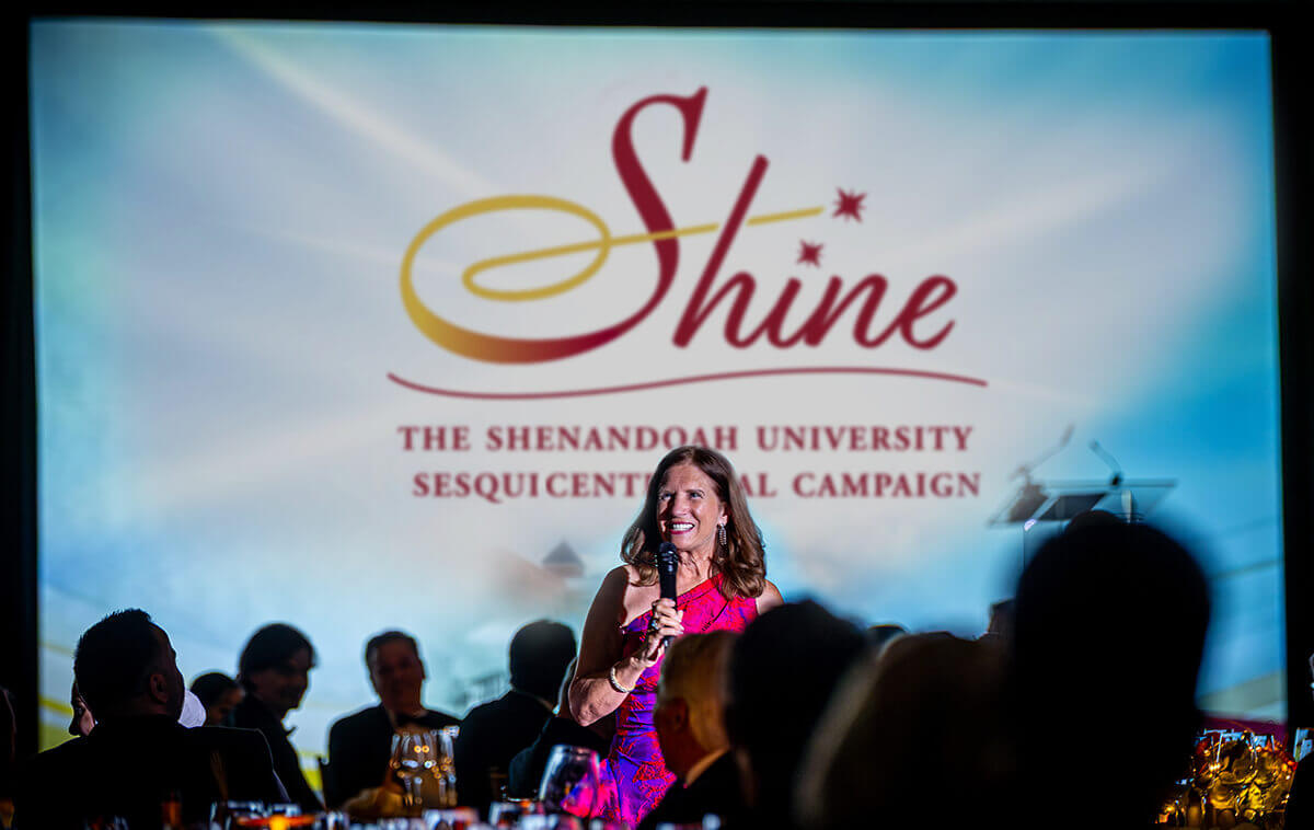University President Tracy Fitzsimmons greets guests at sesquicentenneial gala