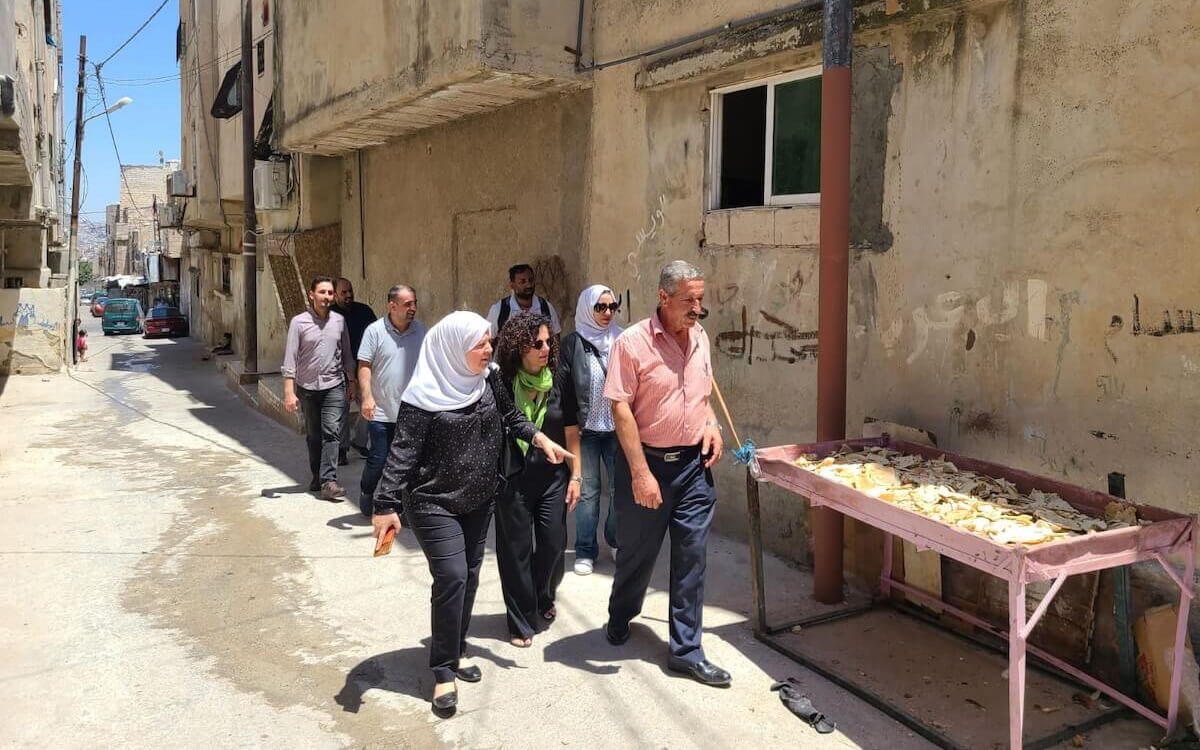 A Shenandoah University delegation tours a refugee camp in Jordan in 2022.