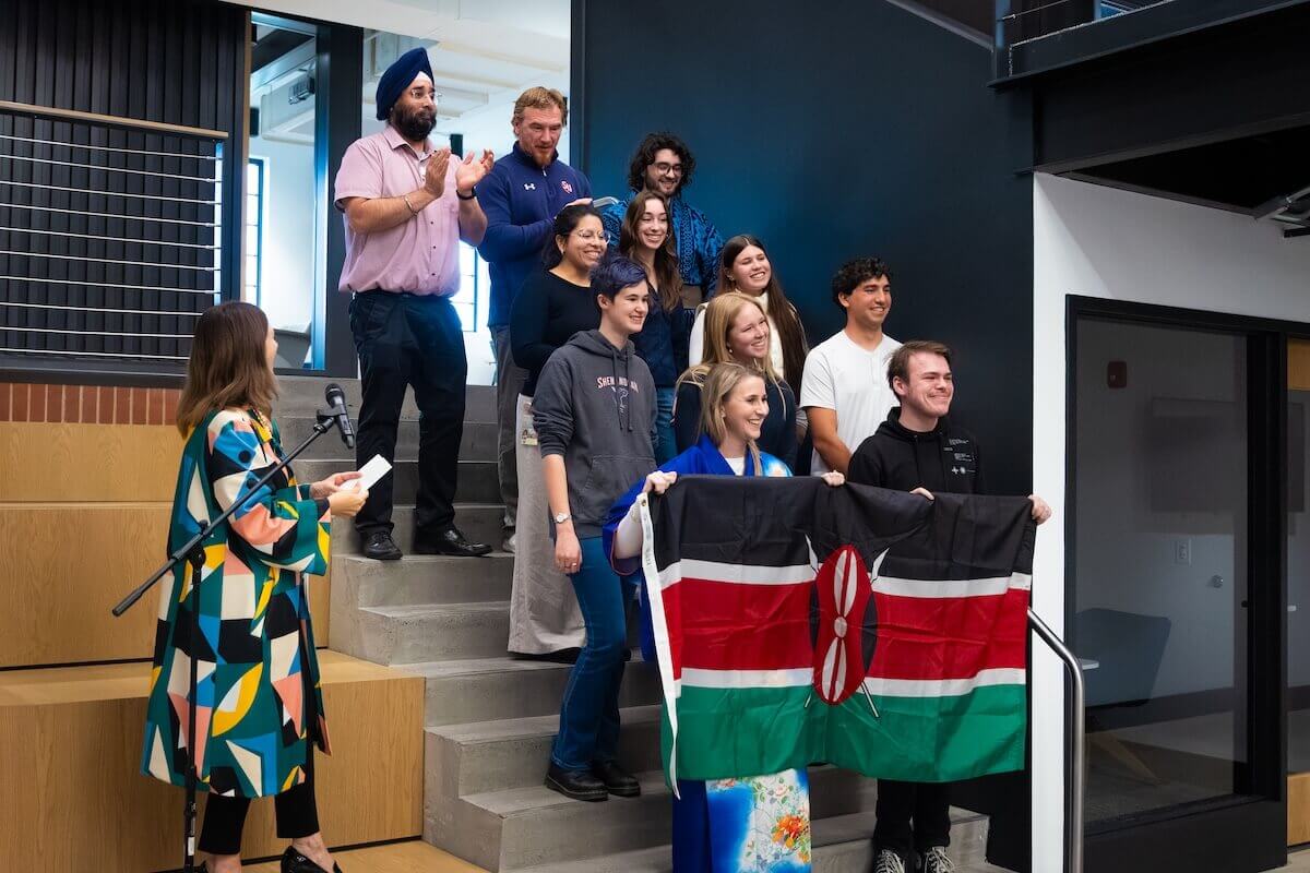 Shenandoah students, faculty and staff hold the Kenya flag.