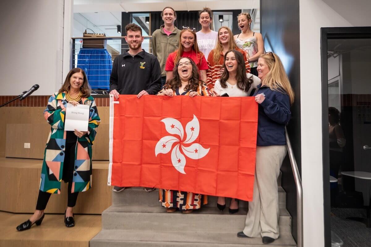 Shenandoah students, faculty and staff pose with the Hong Kong flag.