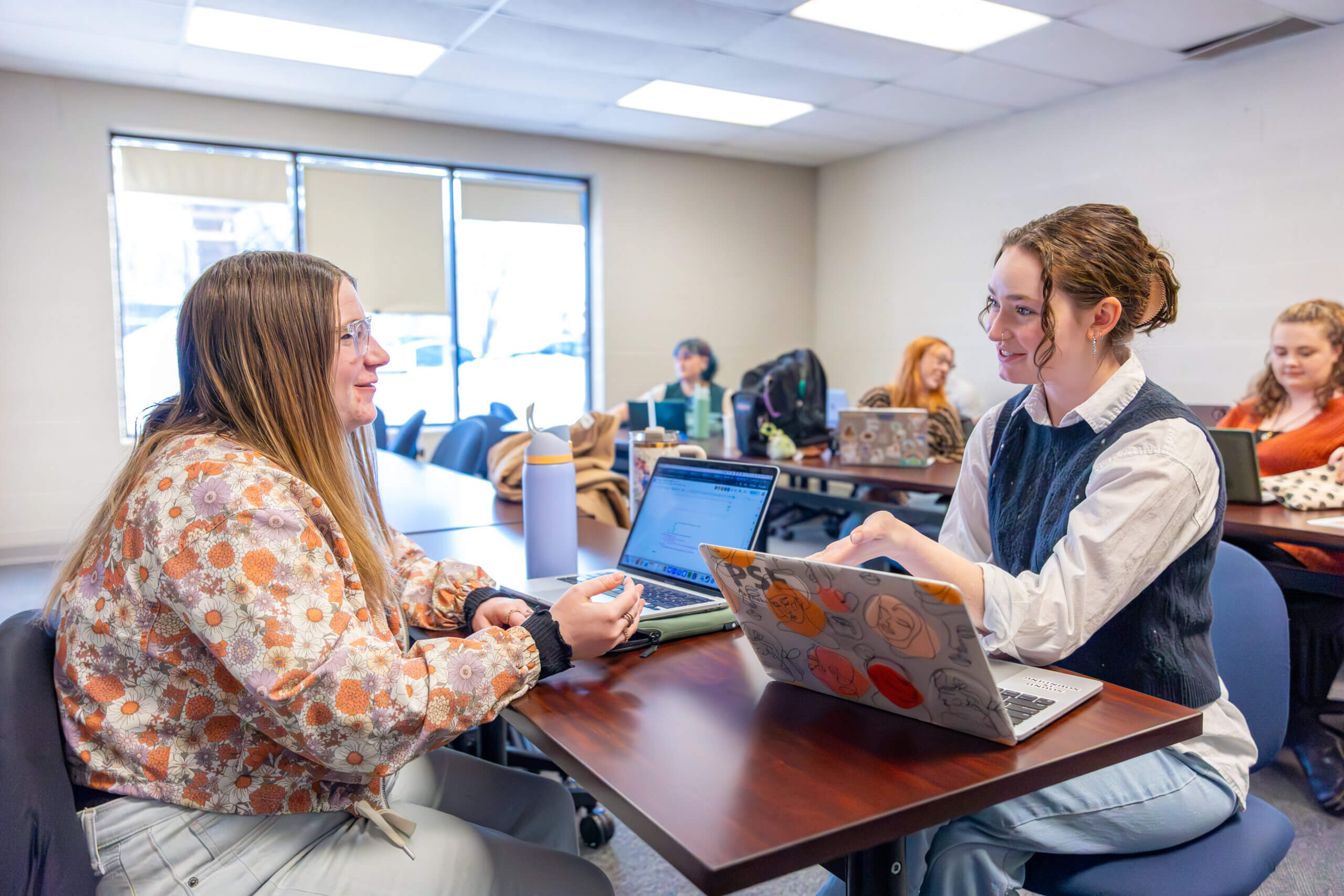 Avalon Spring 2026 officers Katelyn Garback and Caroline Berry discussing