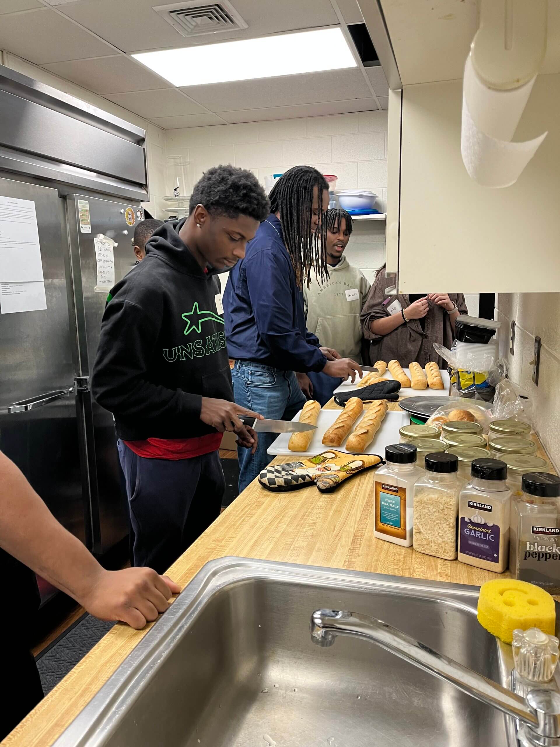 Students serving meals at WATTS