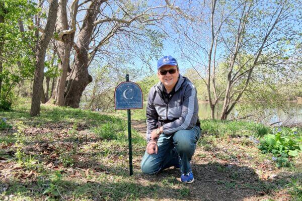 Noyalas crouched at tour stop C on the slavery tour