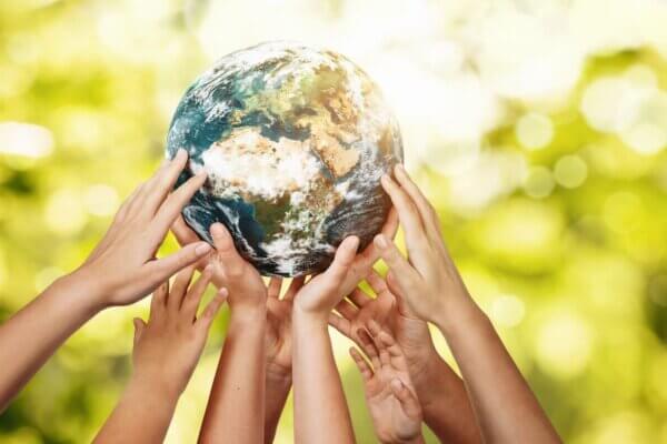 Stock photo of hands holding a globe.