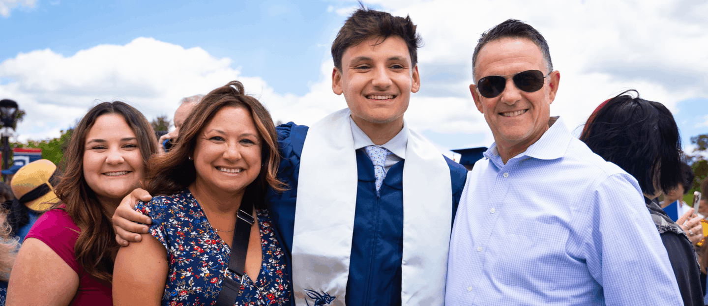 graduate with family