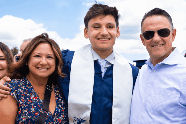 graduate with family