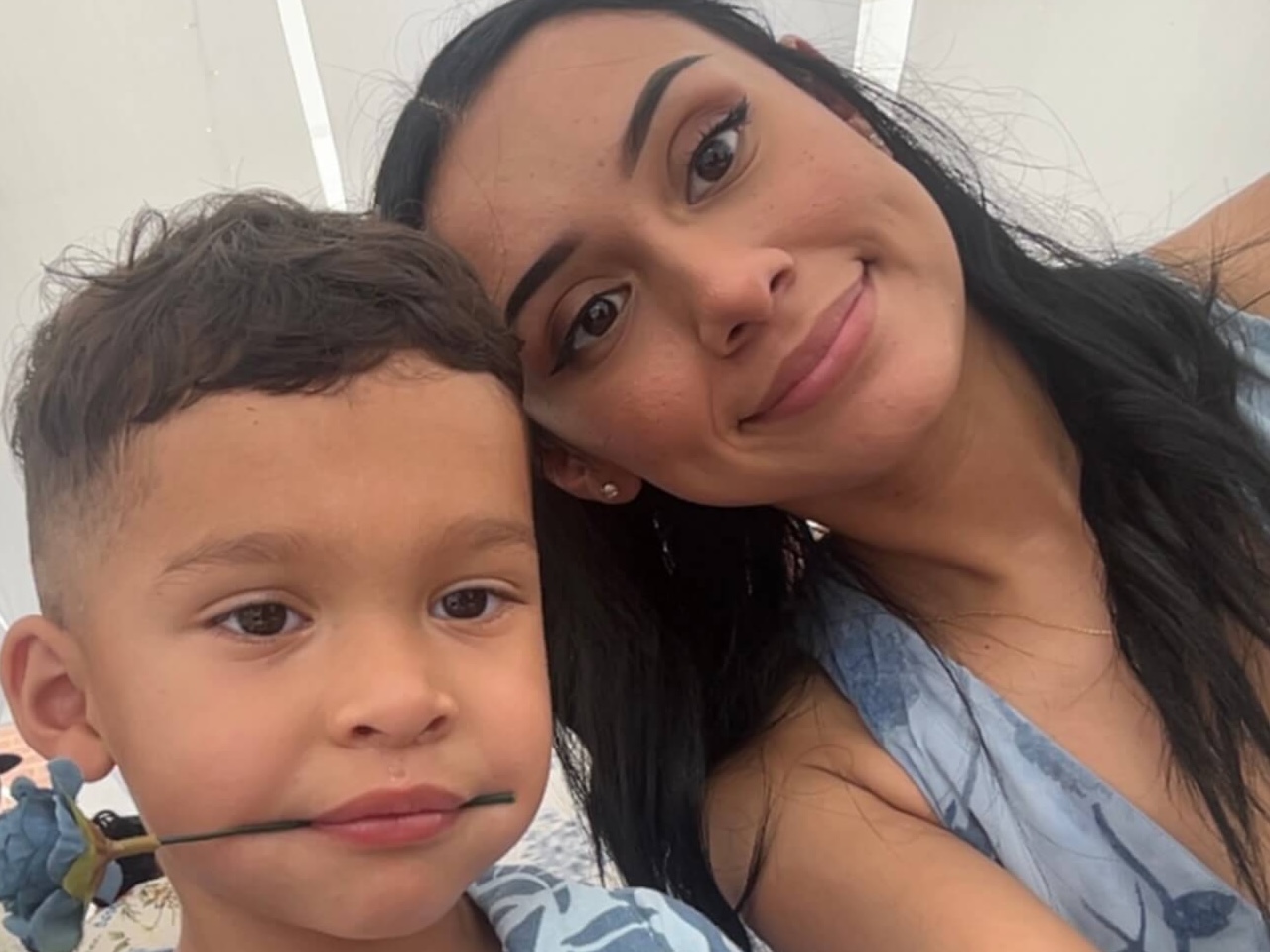 LRCC Co-Enrolled student Sara Hernandez and little boy with a fake blue flower in his mouth.