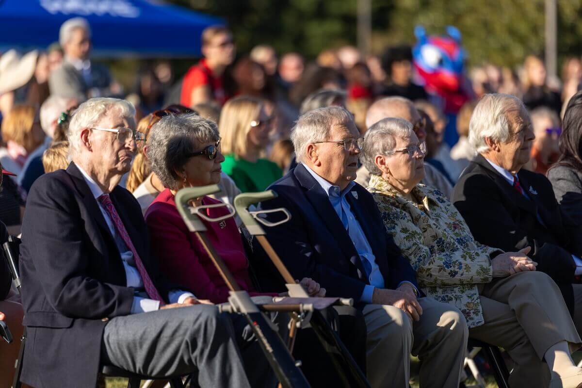 Shenandoah University supporters observe the groundbreaking for the Dove Center for the Arts while seated in the audience.
