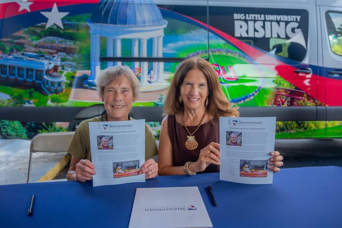 Diane Kearns and Tracy Fitzsimmons hold printed copies of the Robert Solenberger SOAR Endowment.