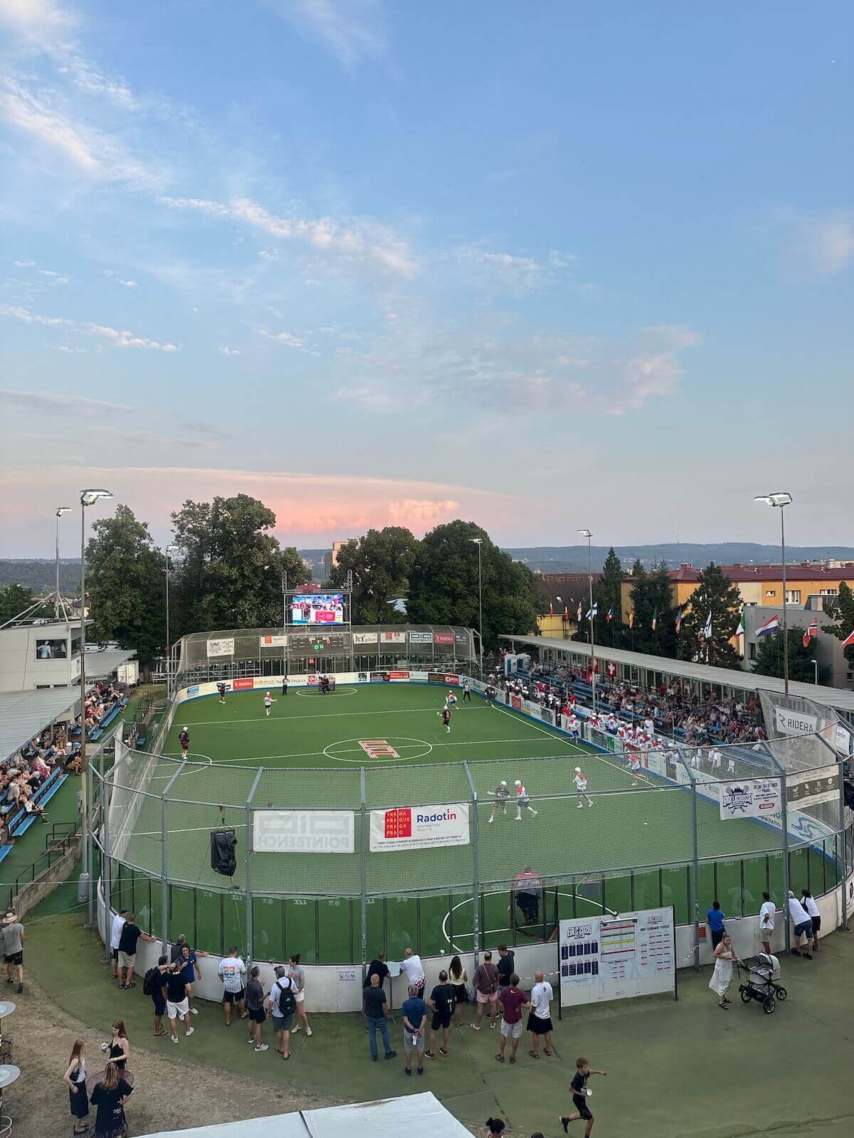 One of the three venues for the European Box Lacrosse Championships in Prague, Czechia, where Shenandoah University exercise science major Katerina Deising '27 interned during the summer of 2026. A green playing field surrounded by a fence can be seen.