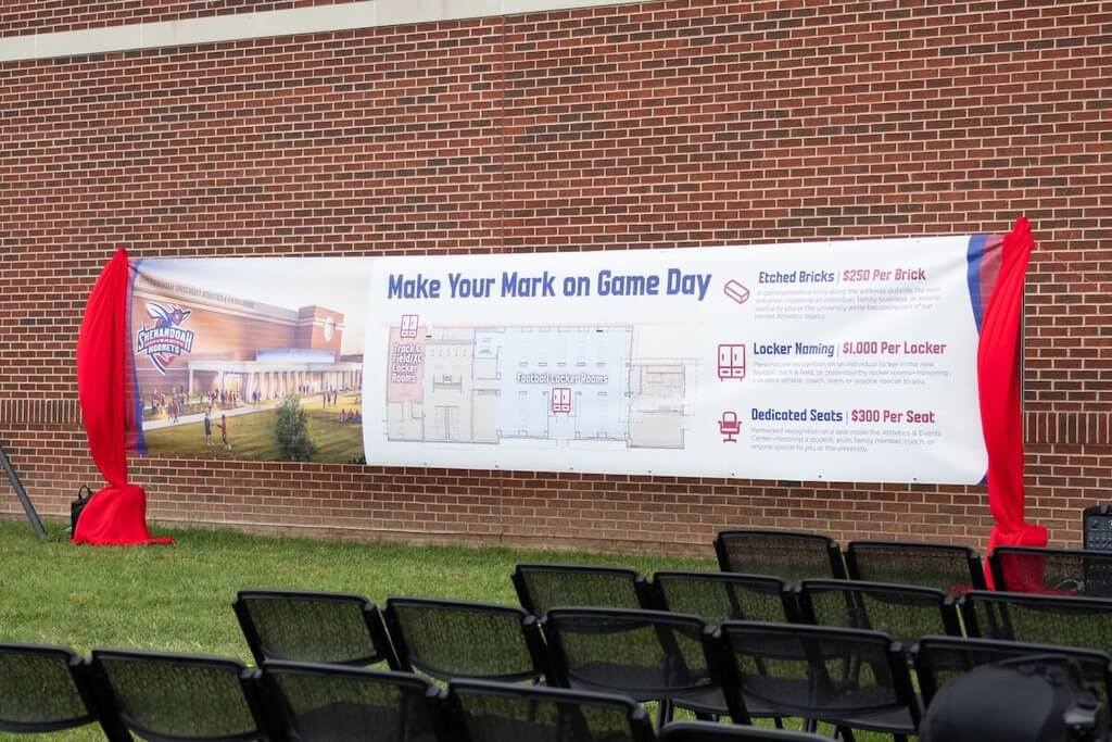A banner displays a rendering of the Wilkins Athletics and Events Center expansion and a list of ways to support Shenandoah Athletics.